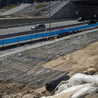 Alta resistenza alla trazione e piccolo allungamento Geogrid in fibra di vetro per il rinforzo del pavimento stradale Protezione della pendenza della diga e progetto di controllo della sabbia
